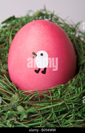 Painted Easter egg in a nest Stock Photo