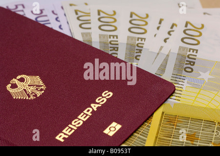 German passport with 500 and 200 Euro bills Stock Photo