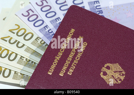 German passport with 500 and 200 Euro bills Stock Photo