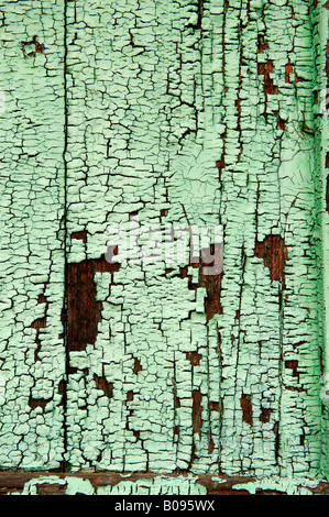 Light green varnish, paint peeling off a wood surface Stock Photo
