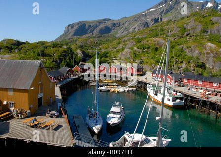 Boats in the harbour and red wooden 'rorbu' houses in Nusfjord, Lofoten Archipelago, Norway, Scandinavia Stock Photo