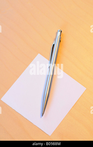 Pen laying on a blank piece of paper Stock Photo