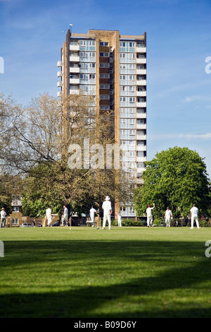 a game of cricket being played on London Fields, Hackney, London Stock Photo
