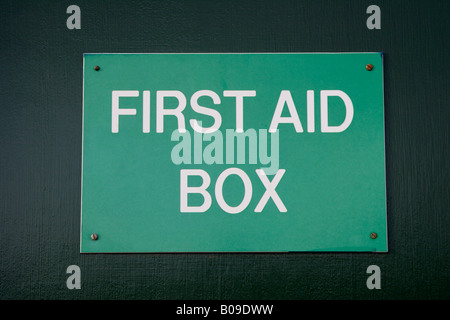 First aid box sign on door close up Stock Photo