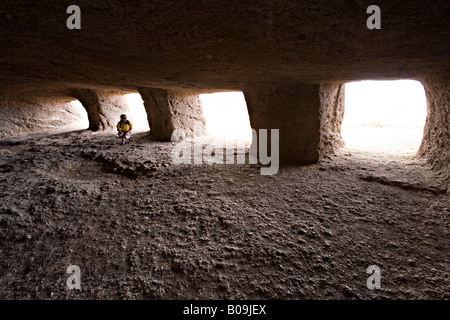 Visitor in Cuevas de Cuatro Puertas archaeological site 'Gran Canaria' Spain Stock Photo