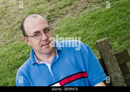 Close up of a middle age balding man wearing glasses posing MODEL RELEASED Stock Photo