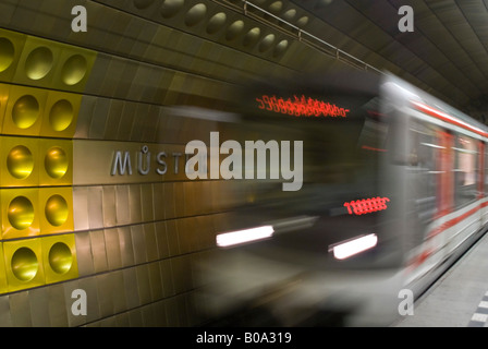 Horizontal wide angle of the Prague underground Metro with a train arriving at a platform in Mustek station with motion blur. Stock Photo