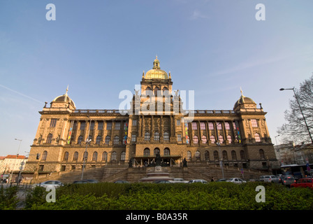Horizontal wide angle of the austere Neo-Renaissance facade of the National Museum 'Národní muzeum' against a bright blue sky. Stock Photo