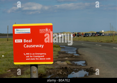 Beal Causeway to Lindisfarne, Holy Island, the road covered in water as the tide comes in Stock Photo