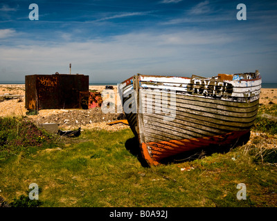 An abandoned old wooden fishing boat at Dungeness in Kent. Stock Photo