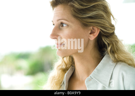 Woman, head and shoulders, side view Stock Photo