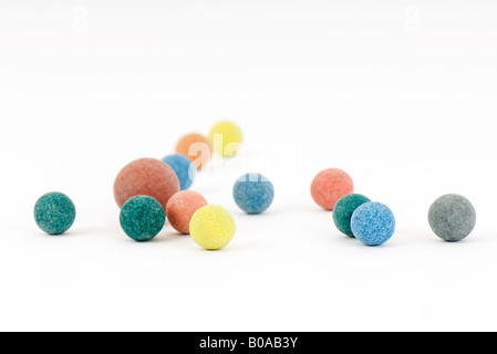 Colorful balls scattered over white surface Stock Photo