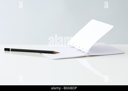 Open notebook and pencil, close-up Stock Photo