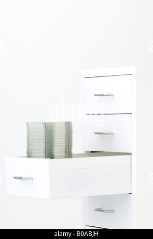 Stack of CDs in filing cabinet drawer Stock Photo