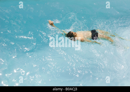 Man swimming backstroke in pool, high angle view Stock Photo