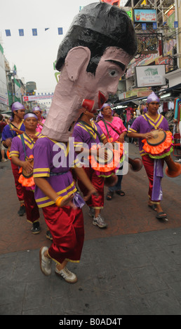 man in giant mask , songkran festival, khao san road parade, bangkok, thailand Stock Photo