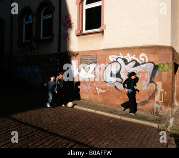 Children playing on the cobbled streets in Freiburg Baden Wurttemberg Germany Stock Photo