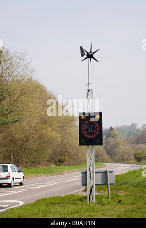 England UK Wind powered 50 mph speed sign illuminated by vehicle on country main road Stock Photo