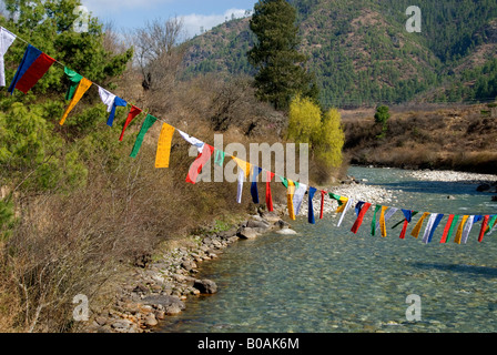 Prayer flags off bridge crossing Paro Chhu (River), upper Paro Valley, Bhutan Stock Photo