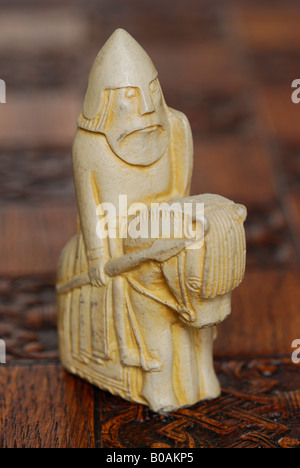A replica set of the Lewis chess men, on board lit by candlelight Stock Photo: 90403837 - Alamy