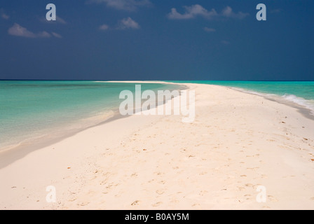 Sandspit blue lagoon blue skies white sandy tropical beach Kuramathi Island Maldives Stock Photo