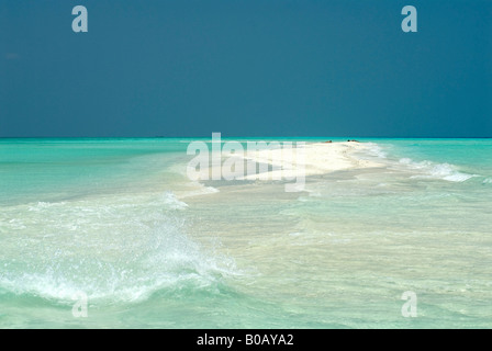 Sandspit blue lagoon blue skies white sandy tropical beach Kuramathi Island Maldives Stock Photo