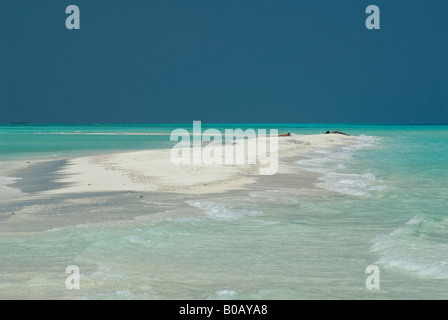 Sandspit blue lagoon blue skies white sandy tropical beach Kuramathi Island Maldives Stock Photo