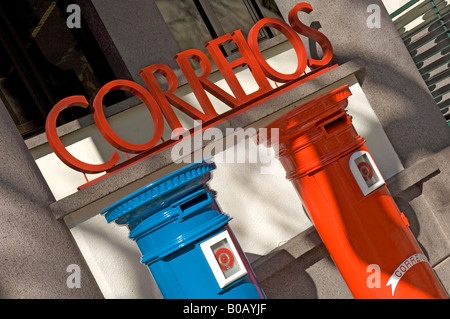 Red and blue post boxes postbox outside post office in a street Funchal Madeira Portugal EU Europe Stock Photo