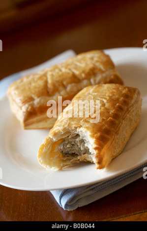 Large Sausage Rolls on plate Stock Photo