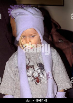 Two Year Old Girl wearing New Hat Scarf and Gloves Stock Photo