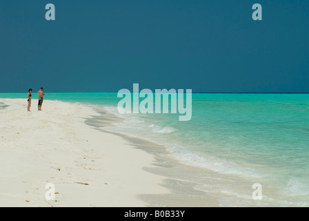 Sandspit blue lagoon blue skies white sandy tropical beach Kuramathi Island Maldives Stock Photo