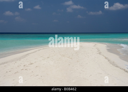 Sandspit blue lagoon blue skies white sandy tropical beach Kuramathi Island Maldives Stock Photo