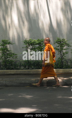 buddhist monk in bangkok heading to amulet market , bangkok , thailand Stock Photo