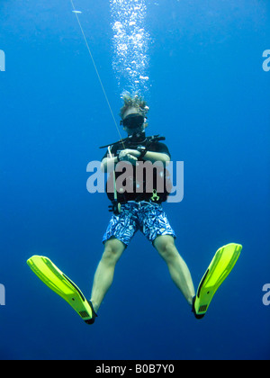 Teenage boy scuba diving in mid water Luke Hanna MR Stock Photo