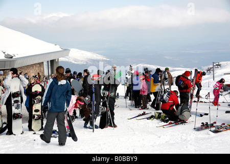 Skiers leaving the top station of the Cairngorm mountain railway Stock Photo