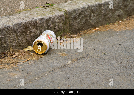 An ^empty beer can in the gutter, UK. Stock Photo