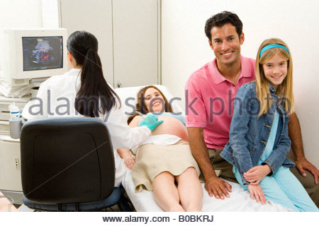 https://l450v.alamy.com/450v/b0bkrj/pregnant-woman-having-ultrasound-scan-with-husband-and-daughter-smiling-b0bkrj.jpg