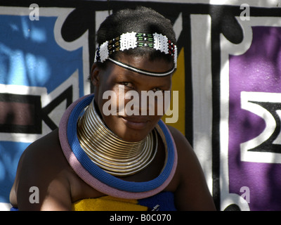 A Ndebele woman in their traditional clothing in the museum village of Botshabelo in South Africa near Middelburg. Stock Photo