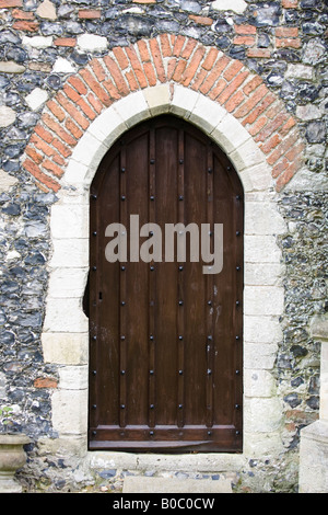 Church door at St Margarets at Stratton Strawless Stock Photo