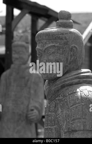 Two statues of ancient Chinese soldiers isolated on white background ...