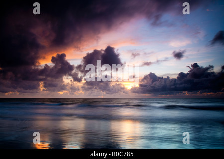 Sunset over the Atlantic Ocean taken at Kololi Beach in The Gambia, West Africa Stock Photo