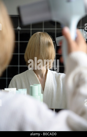 Woman in a bathroom Stock Photo