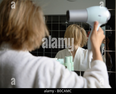 Woman in a bathroom Stock Photo