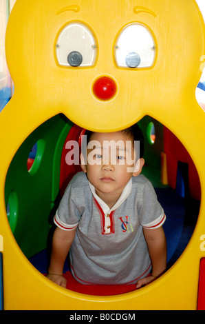 a chinese boy in kindergarten. Stock Photo