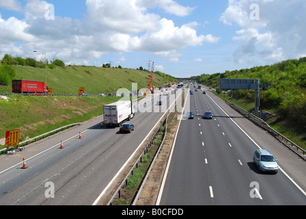 motorway traffic M27 cars UK lane road fast speed congestion full flow ...