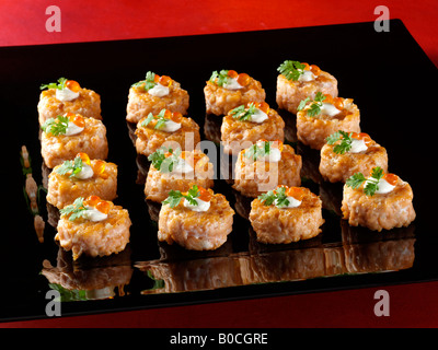 Seared salmon tartare canapes fine dining editorial food Stock Photo