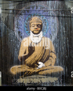 Religious icon, sitting yoga pose - an image from The Cans Festival, a London street exhibition artist Banksy helped to open Stock Photo