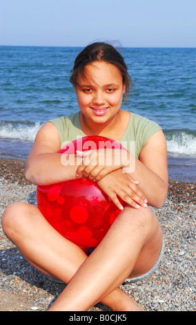 Portrait of a young beautiful girl on sea shore Stock Photo