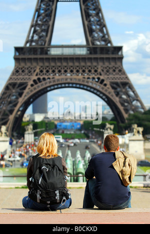 Young tourists enjoying the view of Eiffel tower in Paris France Stock Photo