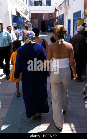 Morocco Essaouira a modern girl with her traditional mother in the souk Stock Photo